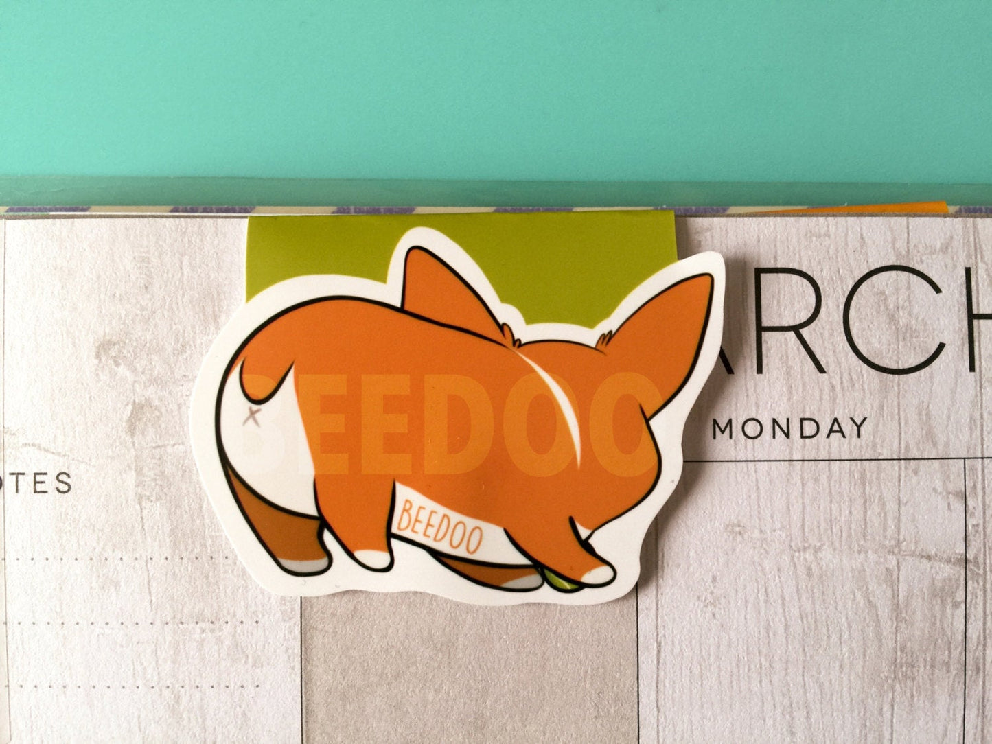 Cute corgi playing with a tennis ball bookmark